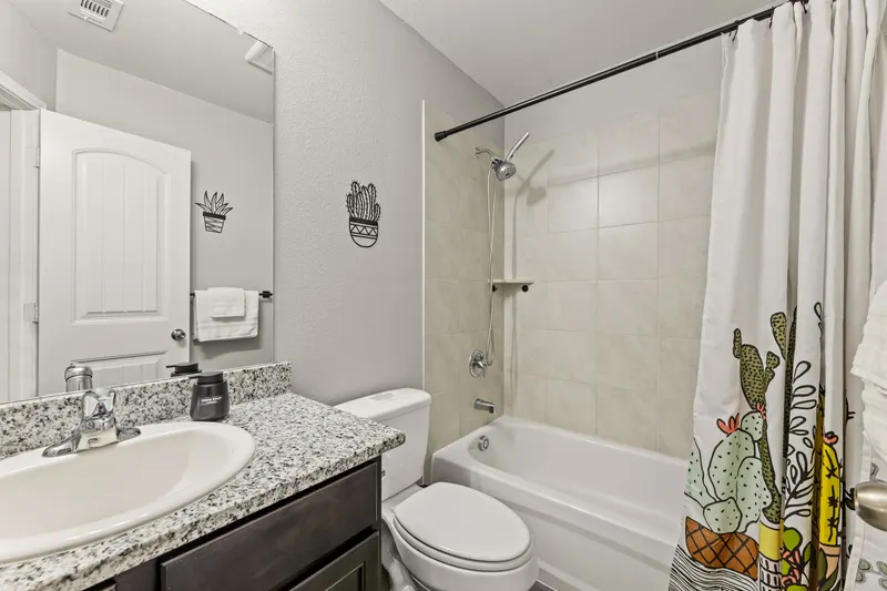 Hall bathroom with cactus shower curtain