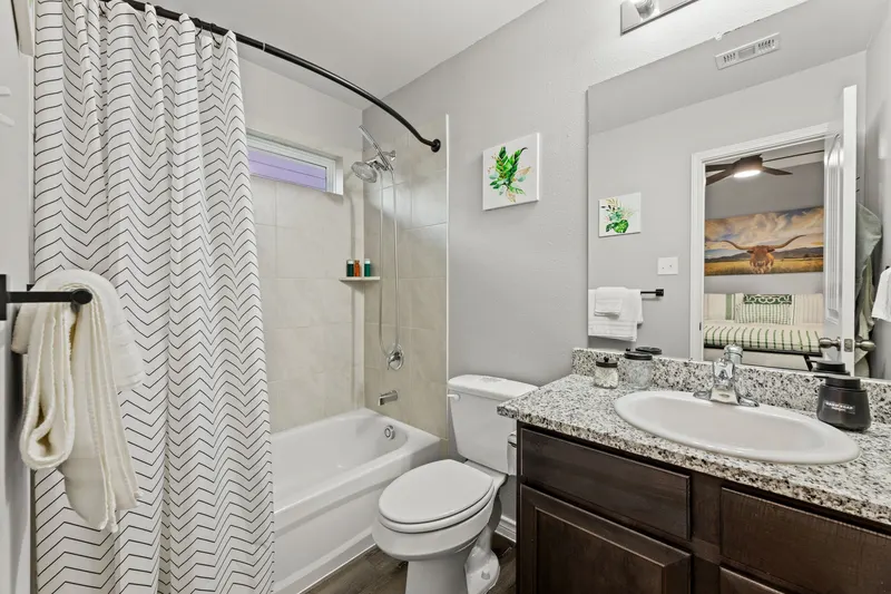 Primary bathroom with tub and shower