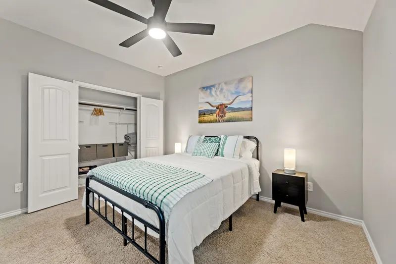 Primary bedroom closet and nightstand
