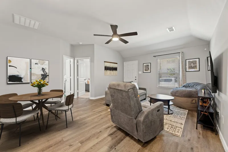 Sunlit living and dining room at Casita Fort Worth